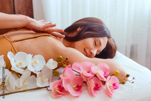Woman enjoying during a relax massage at the spa