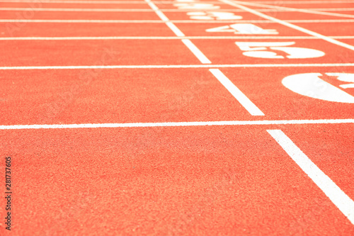 Start of red athletic track with numbers, space for text