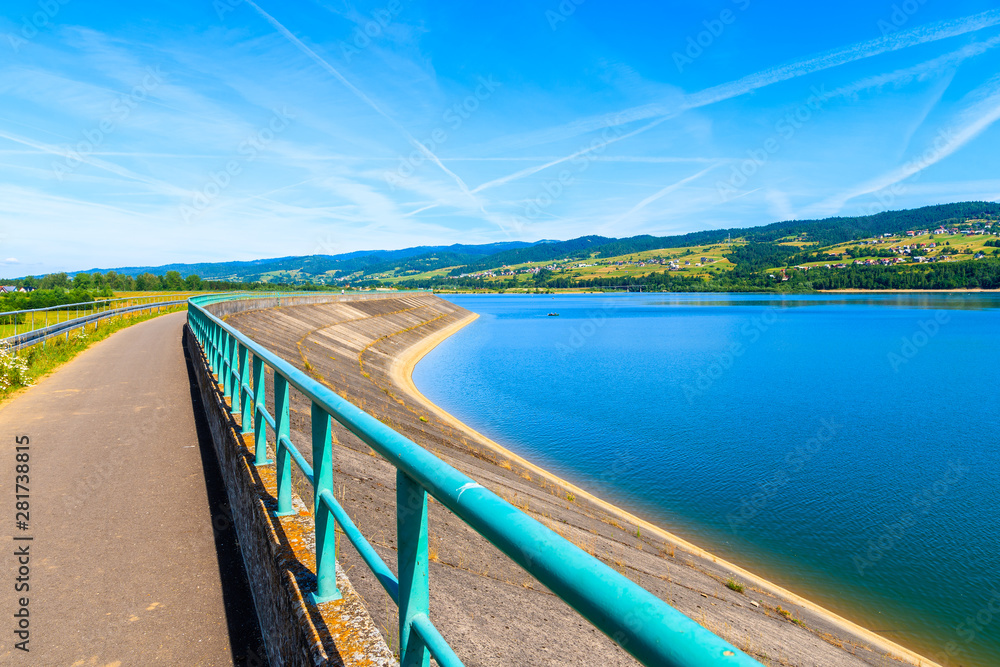 Cycling way along Czorsztynskie lake in Frydman village, Pieniny Mountains, Poland Cycling way along Czorsztynskie lake in Frydman village, Pieniny Mountains, Poland