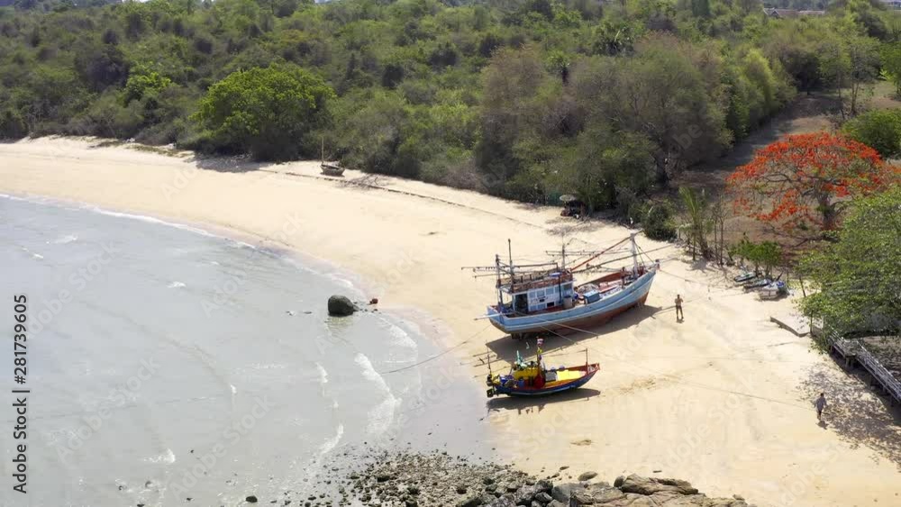 Top view, Boat Parked On The Sea, White Beach On A Clear Blue Sky, Blue Sea. Top view, Boat Parked On The Sea, White Beach On A Clear Blue Sky, Blue Sea.