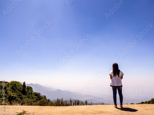 Tourist on the peak of high rocks. © tlovely