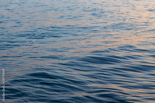 Blue clear water. Beautiful blue sea wave photograph close up. Beach vacation at sea or ocean.