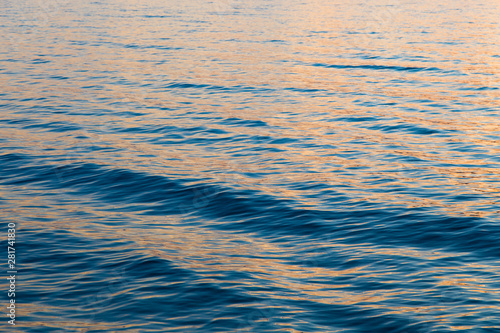 Blue clear water. Beautiful blue sea wave photograph close up. Beach vacation at sea or ocean.