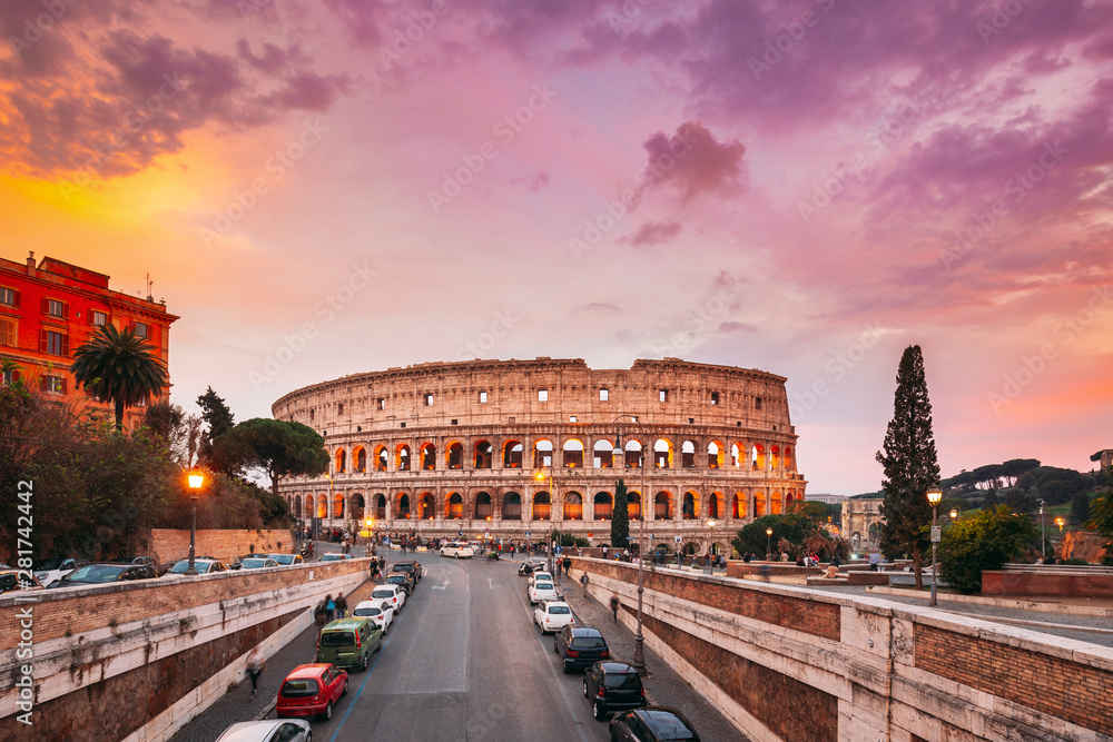 Rome, Italy. Colorful Sunset Sky Above Colosseum Also Known As Flavian Amphitheatre In Evening Time.