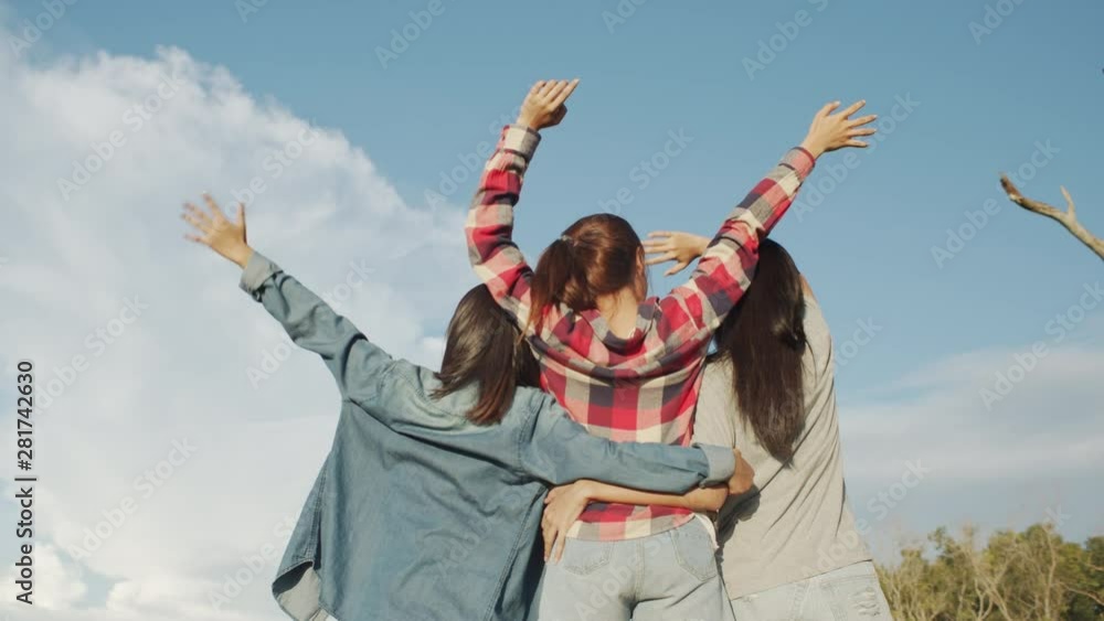 Asian teen girl are waving in the midst of nature in the afternoon. On the weekend day. Vacation relaxation trip concept Asian teen girl are waving in the midst of nature in the afternoon. On the weekend day. Vacation relaxation trip concept