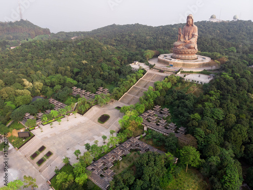 Giant Buddha statue in Mount Xiqiao park, Foshan, China photo