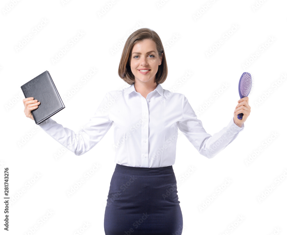 Young businesswoman with notebook and hairbrush on white background. Concept of balance Young businesswoman with notebook and hairbrush on white background. Concept of balance
