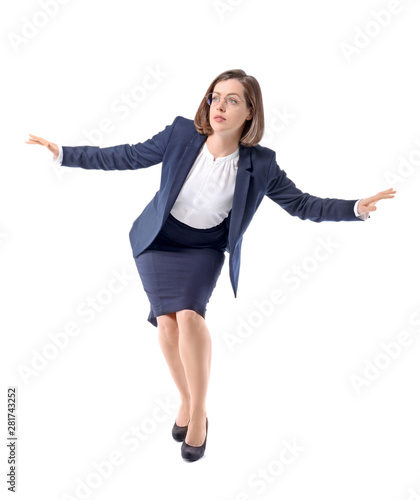 Balancing young businesswom...