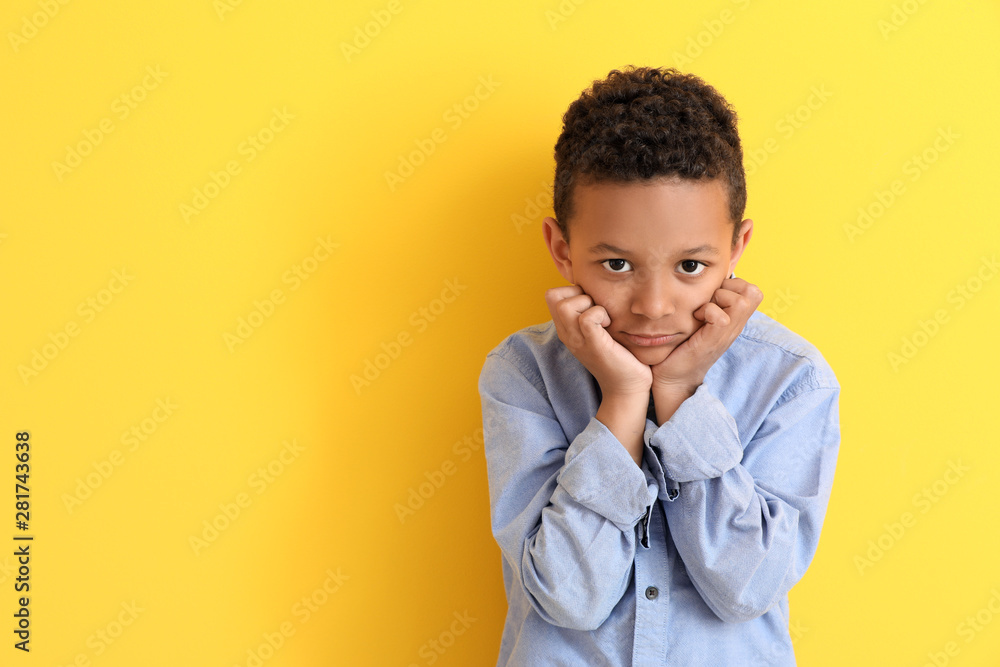 Cute African-American boy on color background Cute African-American boy on color background