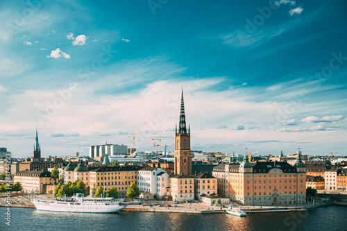 Stockholm, Sweden. Gamla Stan Is Famous Popular Place And Destination Scenic. Riddarholm Church In Sunny Summer Cityscape Skyline. Scenic View Of Embankment In Old Town. UNESCO World Heritage Site
