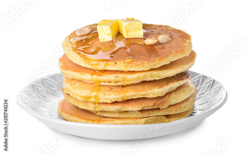 Tasty pancakes with butter on white background