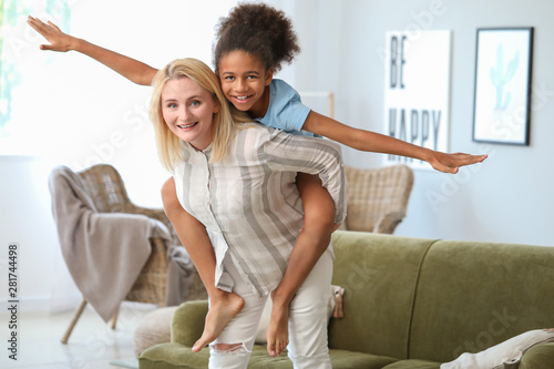 Happy woman playing with he...