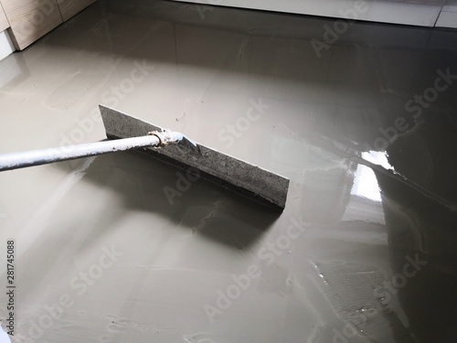 Self-leveling concrete is typically used to create a flat and smooth surface with a compressive strength similar to or higher than that of traditional concrete prior to installing interior floor.