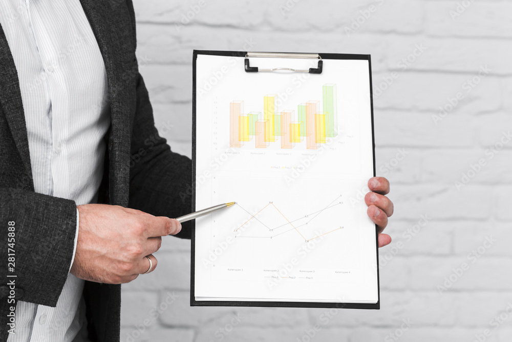 Business people showing charts and statistics Business people showing charts and statistics