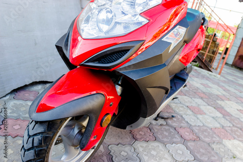 Closeup of red motorcycle. Beautiful modern red motorcycle