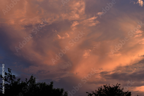 The clouds are lit by the setting sun.