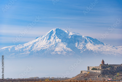 Mount Ararat is located on the Turkish territory with a view of the ancient monastery of Khor Virap on a bright sunny day. with a hazy haze on the sky in the fall in the season yellow-golden brown.