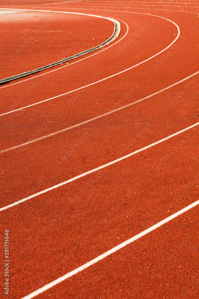 athletic red running tracks whit white lines..