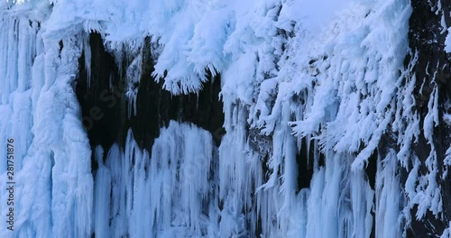 Icicles on frozen waterfall in winter, Shari, Hokkaido, Japan photo