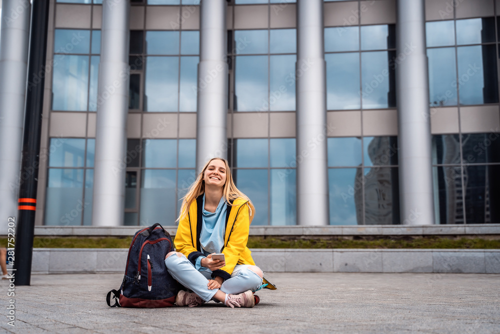 Beautiful girl uses smartphone and sits on skateboard. Beautiful girl uses smartphone and sits on skateboard.