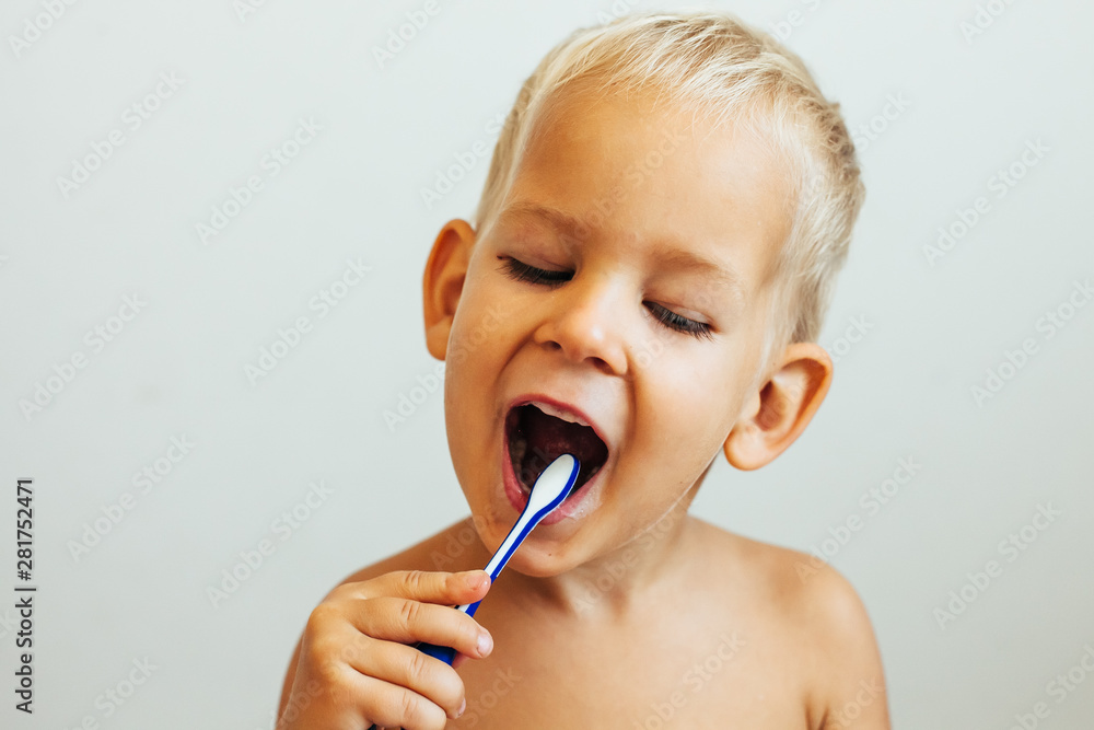 Smiling little boy brushing teeth Smiling little boy brushing teeth