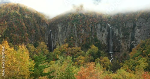 View of waterfalls on mountain, Suzaka, Nagano Prefecture, Japan photo