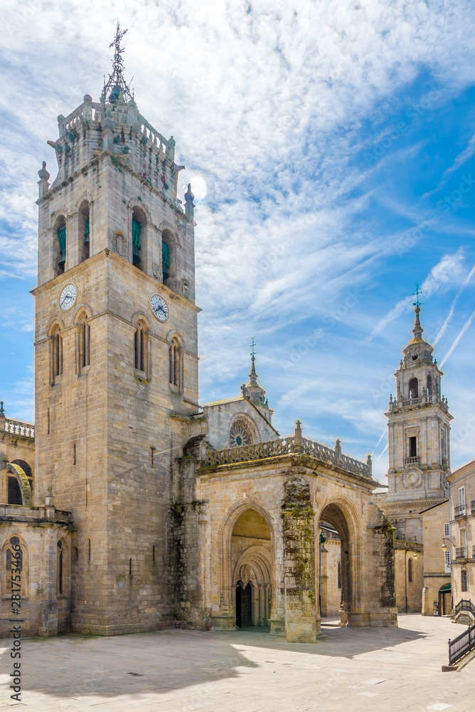 View at the Cathedral building with Clock tower in the streets of Lugo in Spain