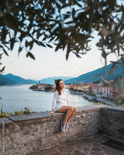 An happy girl in Gravedona city on Lake Como photo