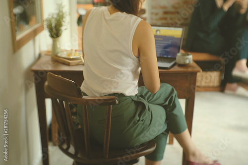 woman sitting on chair © Junjira