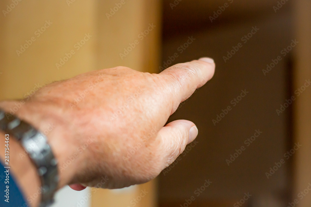 Man's hand with outstretched index finger