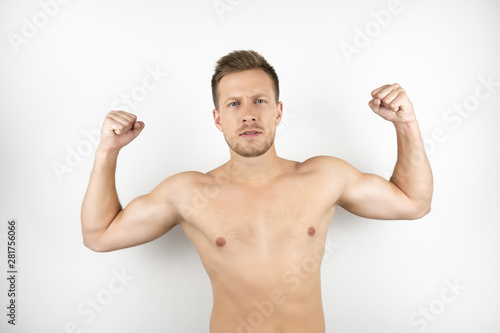 image of handsome strong man with naked torso showing muscles white isolated background