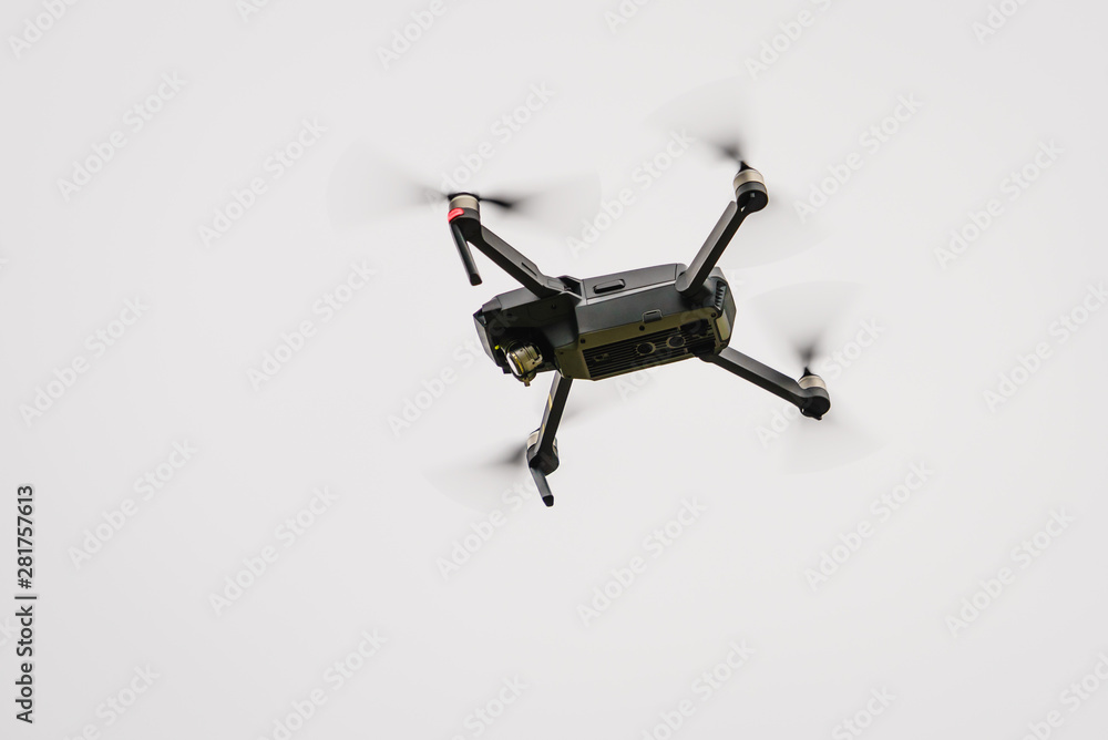 Drone flying over sky background Drone flying over sky background