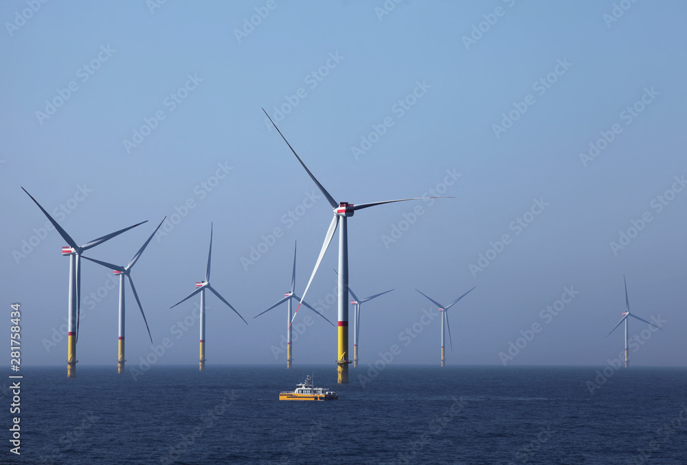 Wind farm offshore. Sustainable green energy.
