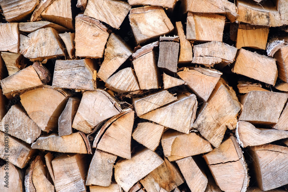 Background of chopped, sawn and stabbed stacked wooden logs. Background of chopped, sawn and stabbed stacked wooden logs.