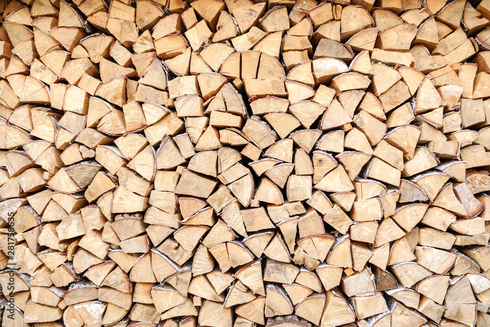 Background of chopped, sawn and stabbed stacked wooden logs. Background of chopped, sawn and stabbed stacked wooden logs.