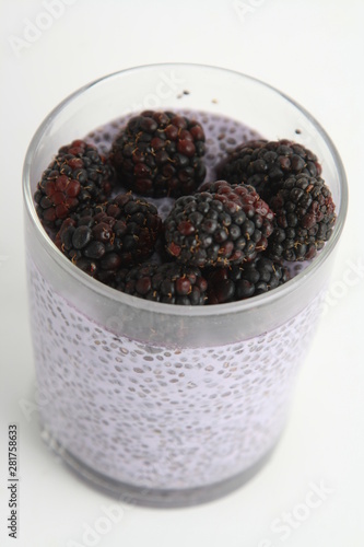 glass of chia pudding with blackberry flavor