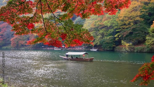 Tourboats in river in autumn, Kyoto City, Kyoto Prefecture, Japan photo