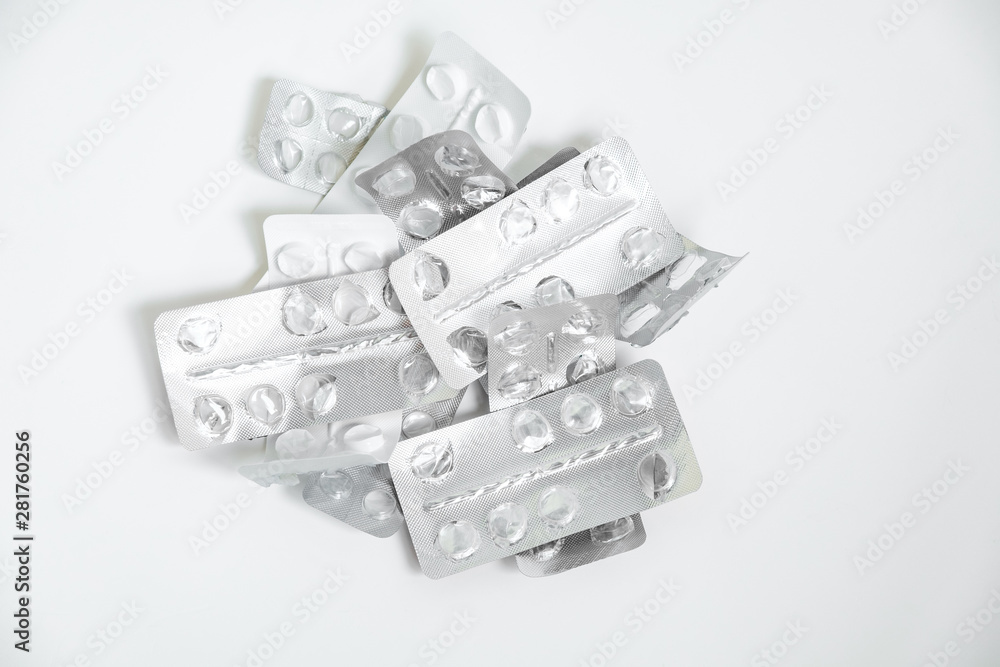 Used drugs, Used capsules, Used antibiotic packaging on white background, Close-up of empty pill package Used drugs, Used capsules, Used antibiotic packaging on white background, Close-up of empty pill package