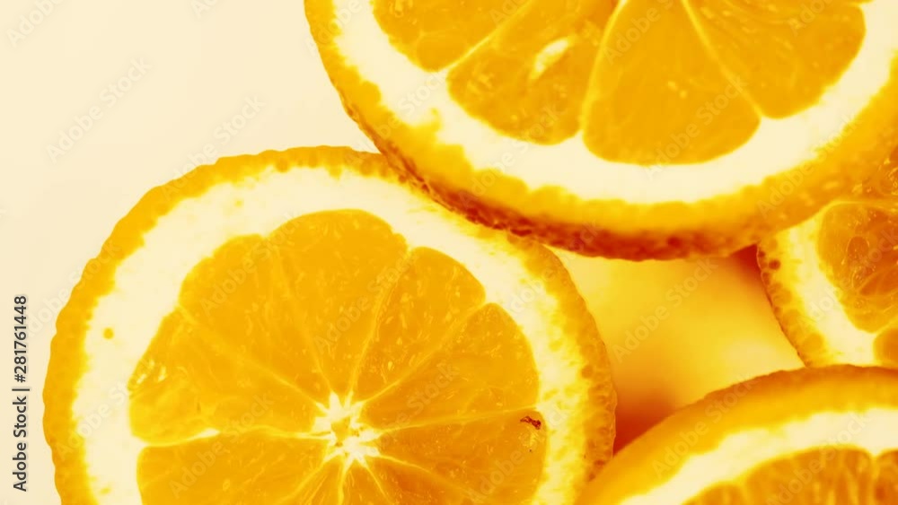 Marco shot of slice orange fruit rotate and isolated on white background. Healthy food concept, Flat lay, top view Marco shot of slice orange fruit rotate and isolated on white background. Healthy food concept, Flat lay, top view