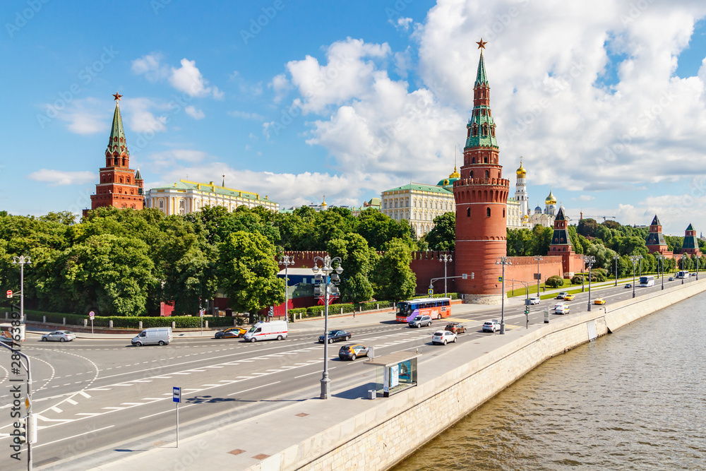 Fototapeta premium Moscow Kremlin against Kremlevskaya embankment of Moskva river in sunny summer morning