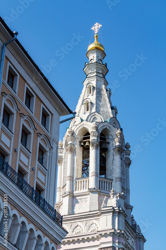 Church Recovery of the Fallen icon of the mother of God in the Middle Gardeners on Sofiyskaya Embankment in Moscow on a blue sky background photo