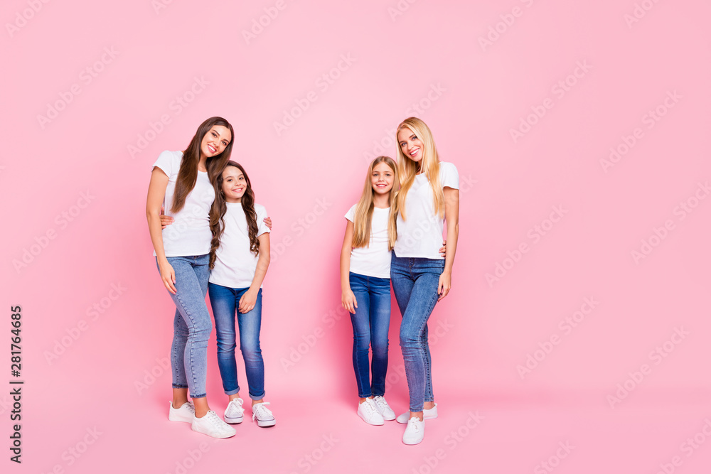 Naklejka premium Full body photo of four different age ladies hugging wear casual outfit isolated pink background