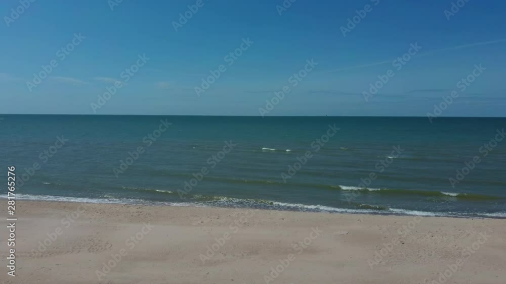 Aerial Dron Shot of the Baltic Sea Costline With Waves View From Above. Sea Waves Over a Sandy Beach. Aerial Dron Shot of the Baltic Sea Costline With Waves View From Above. Sea Waves Over a Sandy Beach.