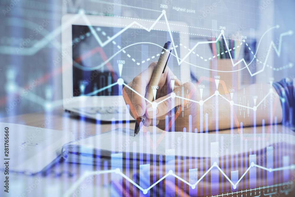 Financial forex charts displayed on woman's hand taking notes background. Concept of research. Double exposure Financial forex charts displayed on woman's hand taking notes background. Concept of research. Double exposure