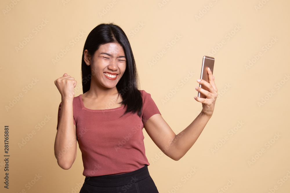 Happy Young Asian woman with mobile phone. Happy Young Asian woman with mobile phone.