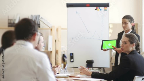 Wallpaper Mural Business meeting at the table in the office, employees actively discuss working moments and laugh. chromakey Torontodigital.ca