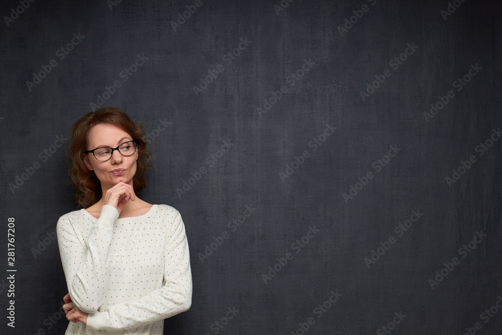 Portrait of thoughtful woman looking at something interesting Portrait of thoughtful woman looking at something interesting