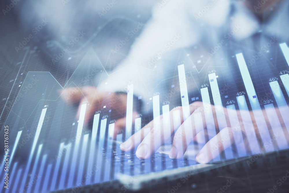 Forex graph with businessman typing on computer in office on background. Concept of analysis. Double exposure. Forex graph with businessman typing on computer in office on background. Concept of analysis. Double exposure.