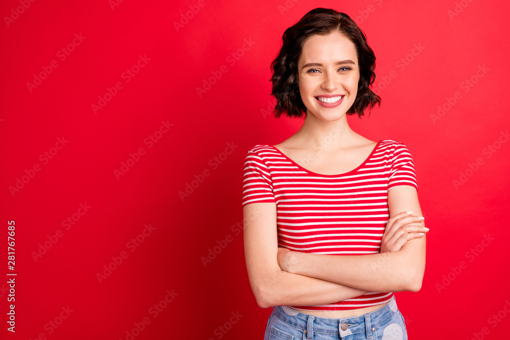 Photo of businesswoman who just starter her career and is ready to reach top while isolated with red background Photo of businesswoman who just starter her career and is ready to reach top while isolated with red background
