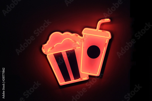 neon sign in cinema. There is a bar, popcorn, drinks